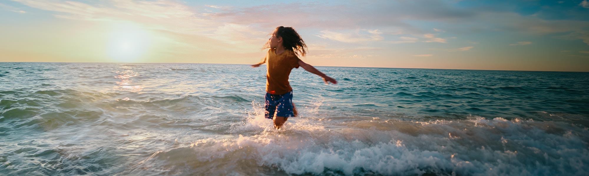 Person doing a hand stand on the beach