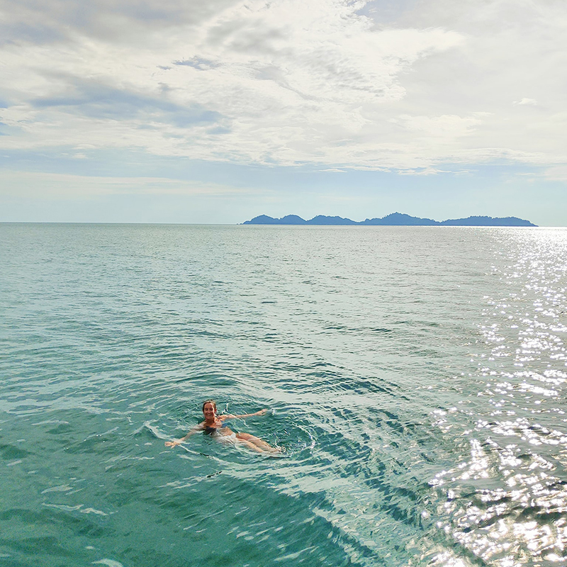 Teneeka enjoys a dip in the ocean while on holiday